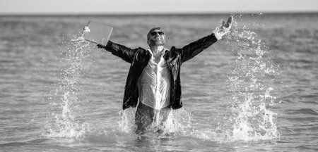 businessman have fun at beach. happy businessman in suit at sea. successful businessman on summer...