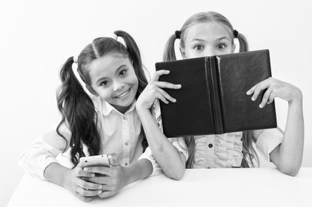 two girls study in school class. education and knowledge. children girls study with books. high...