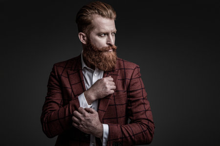 Formal tailored suit. Gentleman menswear. Bespoke suit. Bearded man in tailored formal menswear. Man...
