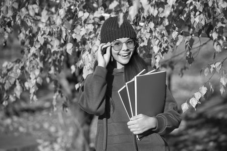 school knowledge. back to school. autumn girl holding school homework. knowledge for adolescence....