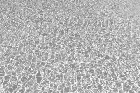 Sea beach background. Summer vacation. Ripple with amazing blue sea lagoon. Sea shore coastline. Bright beach seaside. Beach vacation in summer. Background of ripple water. Caribbean seaの写真素材