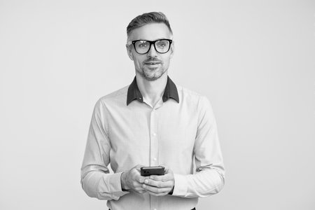 Businessman chatting. Businessman texting and messaging. Social network. Mature business man with...