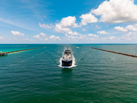 Aerial cargo ship with container. Cargo business. Container ship. Shipping logistics. Commercial shipping. Cargo ship in sea, aerial view. Freight container loaded on cargo vessel. Ship routeの写真素材