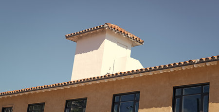Chimney cap on the roof the residential house building architecture with architectural detail