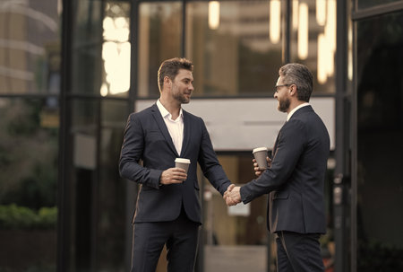 Successful agreement in business deal. Businessmen dealing outdoor. Partnership concept....