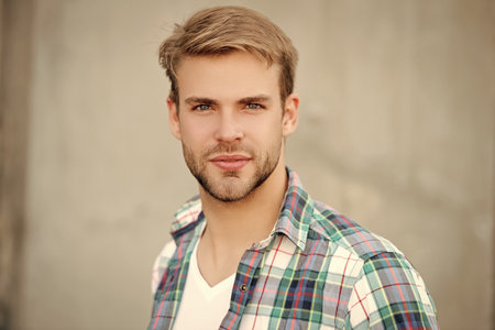 Portrait of man in casual style shirt. Stylish face portrait of unshaven guy. Handsome young man...