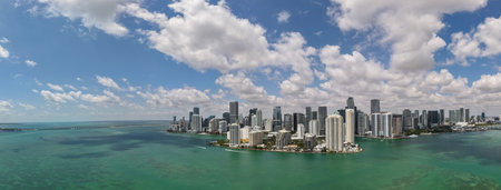 Panorama of Miami skyline. Panorama cityscape of Brickell Miami. Scenic drone view of Florida coastline. Miami skyline with skyscrapers. Aerial view of Miami in summer.の写真素材