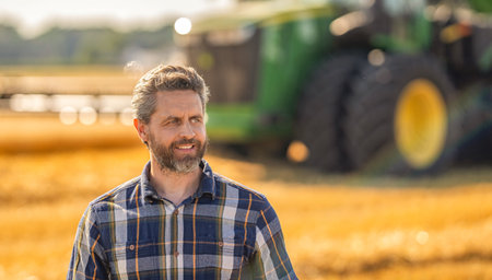 Agriculture farm. Farm man at wheat field. Crop harvest and farming. Farmer in field. Hispanic man farmer check agriculture field harvest. Man agronomist farmer. Crop protection, copy spaceの写真素材