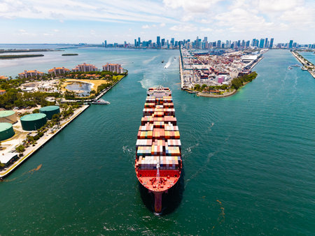 Freight container loaded on cargo vessel. Aerial ship with container. Cargo business. Container ship. Shipping logistics. Commercial shipping. Cargo ship in sea, aerial view. Cargo ship deckの写真素材