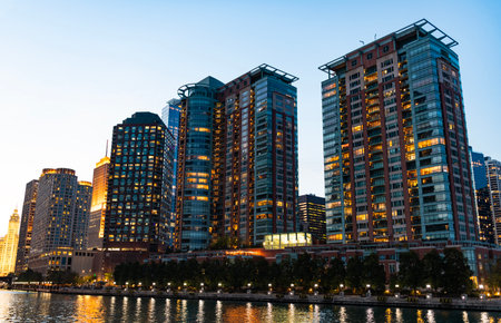 Architectural Chicago city downtown. Skyscraper architecture. City cityscape. Cityscape with building. Downtown architecture and river. Illuminated city. Chicago River cruises in Cityの写真素材