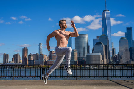 Morning sport workout runner running in NY. Sportsman man running. Running man in Manhattan. New...