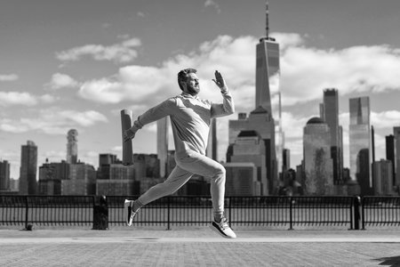 Sport routine. Athlete man running outdoor. Sport running morning exercise. Man runner training in...