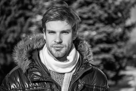 man face in winterwear at holidays. man in winterwear jacket. man in winterwear outdoors.の写真素材