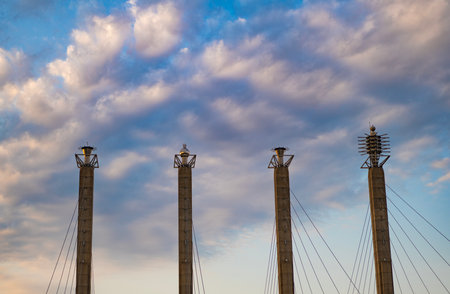 Building design. Modern architecture. Modern building architecture against blue sky. Architectural pylon detail. Exterior of building with pylon. Structural architecture.の写真素材