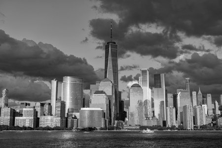 New York city of America. Skyscraper building of NYC. NY city architecture. Midtown Manhattan at Hudson river. Sunset city. Cityscape in sunrise. New York downtown. Manhattan skyline. Dramatic skyの写真素材