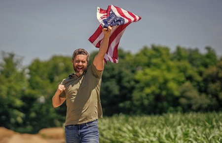 American flag and man farmer, harvest. Flag of USA. Independence day. Man in field. Patriotic man...