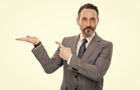 Business offer. Successful businessman offering deal. Businessman suggest company. Business advertisement. Business man in suit isolated on white. Advertisement and announcement. presenting productの写真素材