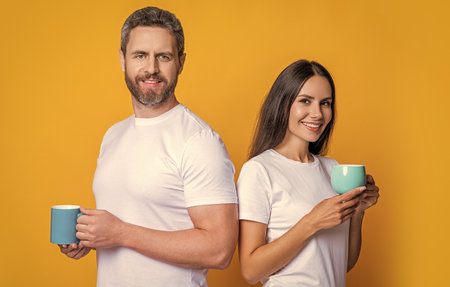 Couple of man and woman drinking tea. Family day together. Warm relationship. Coffee break at home....