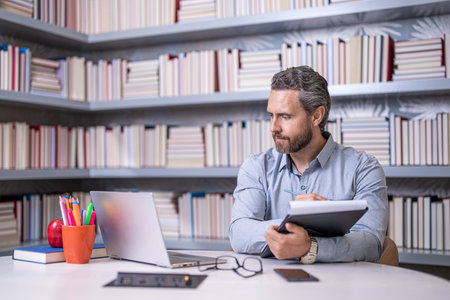 knowledge of educated man. College teacher. Teacher in classroom. man teacher study at workplace....