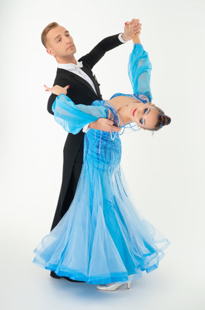 Dancer of ballroom dance. Sport dance. Dance couple isolated on white. Ballroom dancer dancing waltz. Couple dancing waltz. Professional ballroom dancer couple. Dancing waltz couple. Ballroom gownの写真素材