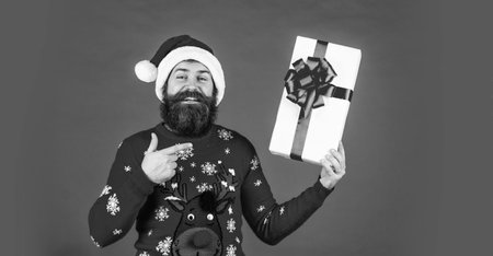 Delivery service. Happy client. Christmas tradition. Man xmas celebration. May all your days be happy and bright. Christmas gift shopping. Peace and joyの写真素材