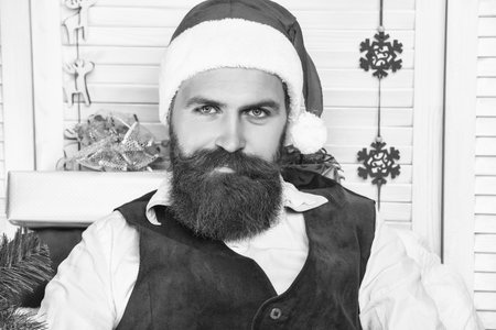 Happy New 2025 Year. Xmas holiday celebration. Santa man in retro style with moustache. Cozy Christmas at home. Man celebrate Xmas. Merry Christmas. Santa Claus retro man smilingの写真素材