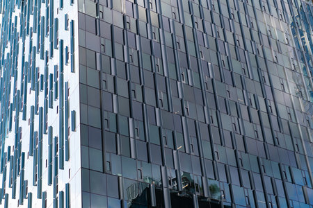 Building background. Glass reflecting building. Architectural detail. Background of architecture. Modern glass background. Glass exterior background. Architecture. Building exterior architectureの写真素材