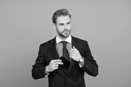 Businessman isolated on grey. Successful business man. Business communication. Man reply on business phone call. Confident businessman. Boss always using phone for communication. Stay onlineの写真素材