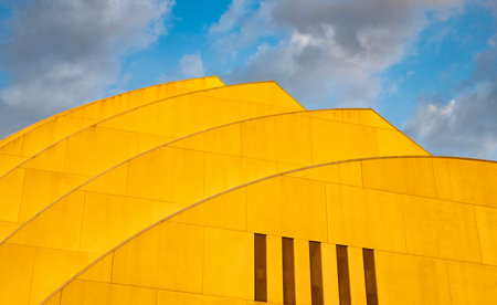 Modern building architecture against sunset sky. Architectural geometrical detail. Exterior and modern shape. Geometric building design. Modern architecture. Geometric shapeの写真素材