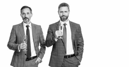 celebrate business deal. two businessmen celebrating contract deal with champagne. successful agreement in business deal. businessmen dealing isolated on white. partnership concept. bannerの写真素材