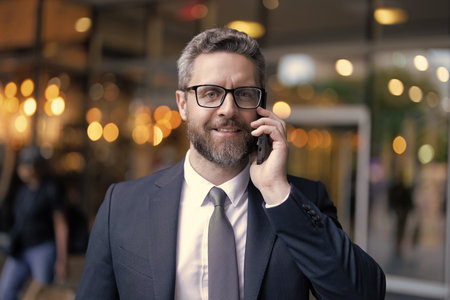 Business call. Man in suit talk on phone. Phone call. Mobile communication. Negotiation online....