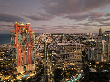 Miami South beach at night. Aerial view on skyscraper cityscape at night. Night city aerial view. Luxury skyscraper. Illuminated. City skyline in evening sundown. Aerial cityscape. Vibrant nightlifeの写真素材