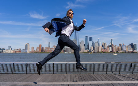 Successful deal. Business success. Successful businessman hurrying on New York city. Business man in Manhattan. Business success in big city. Businessman running to success. Professional rush hourの写真素材