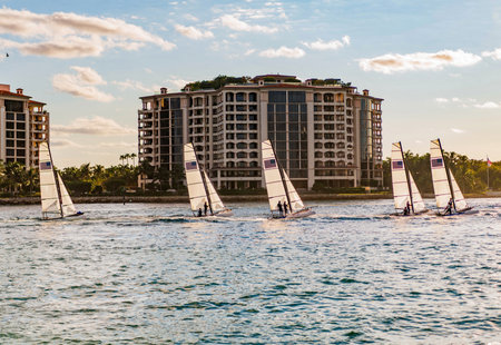 Yacht regatta at sea. Sea vacation on summer. Fisher island building. Sailing boat yacht. Yachting...