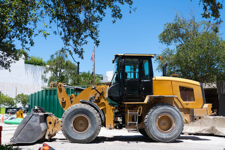 Heavy equipment of compact wheel loader with hydraulic system. Wheel loader heavy machinery outdoor....