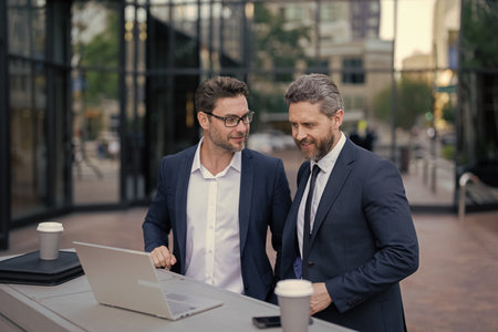 Stock business trading. Businessmen trading online outdoor. Research and finance. Businessmen...