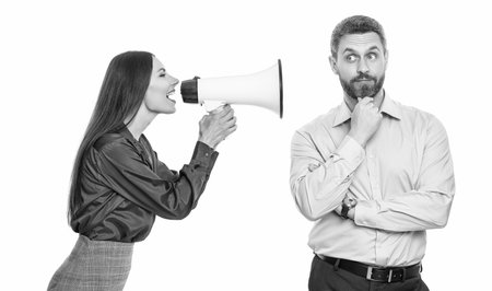 solving conflict. rivalry concept. business conflict. businesswoman shout on employee in loudspeaker isolated on white. business boss has conflict with partner about promotion. Promotional activitiesの写真素材