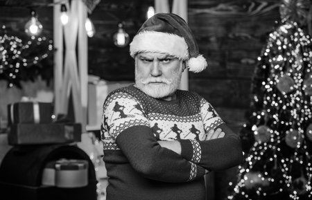 Man senior Santa claus wear sweater nordic pattern. Christmas traditions. Stick to traditions. December sale. Knitted sweater. Celebrate new year. Winter traditions. Santa Claus. Stylish elderly manの写真素材