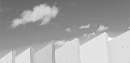 Geometric building design. Modern architecture. Geometric shape. Modern building architecture against blue sky. Architectural geometrical detail. Exterior and facadeの写真素材