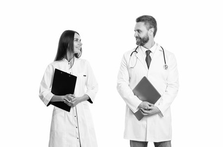 medicine and healthcare. doctor at hospital. two doctor hold medical prescription. doctor and nurse with clipboard isolated on white. professional physician with internist. doctor prescriptionの写真素材
