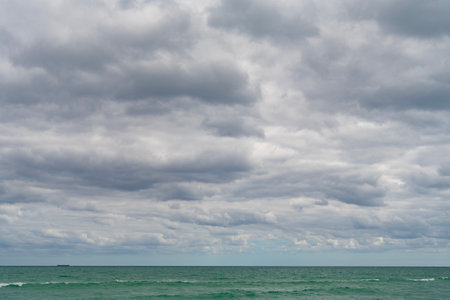 Horizon with sea cloudy sky. Calm horizon at sea. Romantic summer vacation seascape. Seascape horizon paradise. Sea sunrise on ocean beach. Sunset seascape at summer vacation. Walk along beachの写真素材