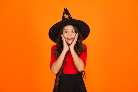 October 31. Teen girl in witch costume. Happy Halloween. Girl witch in Halloween costume isolated on...