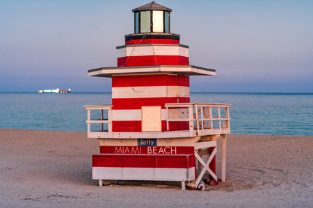 Miami Beach pier. Iconic lifeguard tower on Miami Beach. Scenic view of Miami Beach coastline. Famous South Beach lifeguard. Tropical paradise in Miami. Art Deco lifeguard on Miamis shoreline.の写真素材