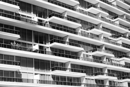 Glass building design. Architectural detail. Background of architecture. Modern residential background. Glass background. Architecture. Building architecture. Building background with balconiesの写真素材