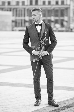 elegant man bridegroom in tuxedo. bridegroom wearing tuxedo bowtie outdoor. mature bridegroomの写真素材