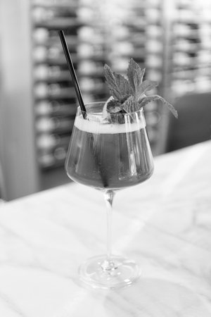 Cocktail drink. Aperitif in the bar. Summer refreshing cocktail. Drinking alcohol beverage. Glass of cocktail aperitif beverage. Summer drink. Cocktail in bar. Lemonade drink in glassの写真素材