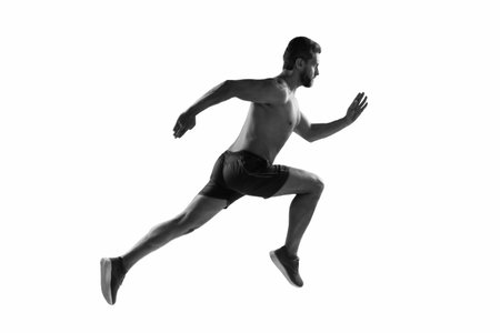 Sport run. Muscular man sporting and running. Sportsman jogger running. Man sportsman running for exercise. Sport athlete man run. Runner at long sport run. Sportsman runner running isolated on whiteの写真素材