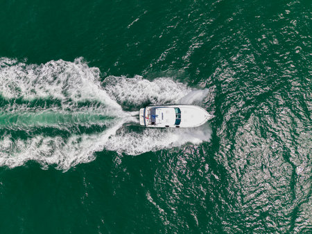 Yacht go to marina. Boating and yachting. Luxury lifestyle. Marina yacht club. Summer holiday. Yacht luxury view at sea. Vacation on summer. Summertime motorboat tour. Luxury motor boat yachtの写真素材