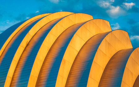 Geometric building design. Modern architecture. Geometric shape. Modern building architecture against sunset sky. Architectural geometrical detail. Exterior and modern detailの写真素材