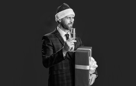 celebrate xmas. smiling businessman celebrate xmas isolated on red. xmas businessmanの写真素材